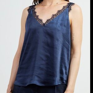 New with tags. Lace trim satin cami. Navy color. Skies are Blue